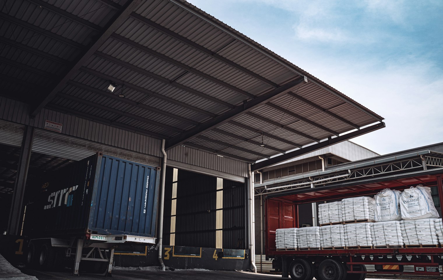 Curtainsider trailer being loaded at a warehouse